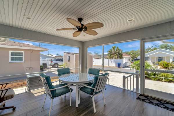 Screened in back porch with a fan for added comfort