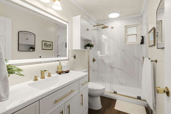 Unwind in our newly renovated, spa-inspired bathroom featuring modern fixtures and a fresh, tranquil design.